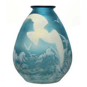 Signed Galle French cameo art glass vase, 11 inches in height, having a beautiful ice blue ground with white cameo carved overlay featuring sixteen seagulls in flight over ocean waves ($40,250).