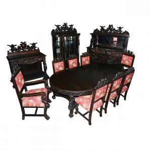 12-piece dining set by R. J. Horner in the Oak Busted Lady pattern, featuring an 82-inch-tall china cabinet, a buffet, a sideboard, a table with three leaves and eight dining chairs ($18,700).