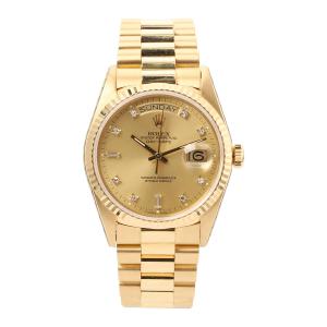 Rolex Day-Date “President” wristwatch, Ref. 18038, circa 1988, with 18kt yellow gold case and bracelet and champagne diamond dial, serviced by Rolex Aug. 2002 (CA$23,600).