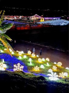 View of the lights at the Hikari festival grounds from the hilltop at Tanaka Farms.