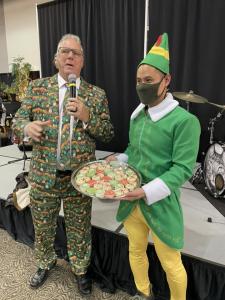 Macadons elf delivers official Christmas cookie to Santa