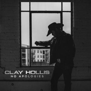 Clay Hollis in silhouette against a window