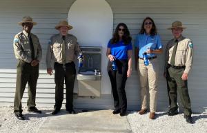 Members of the Florida State Parks Foundation, Duke Energy and the Florida Park Service try out a new water bottle refilling station at Honeymoon Island State Park.