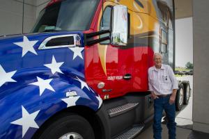 Delivering a truckload of commemorative wreaths to Arlington National Cemetery is CFI's Don Welch, piloting a special "True to the Troops" truck honoring the nation's military