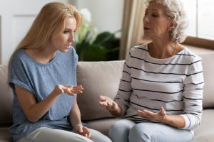 woman talking to adult child