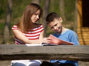 Image of young boy trying to read