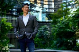 Zen KOH, Co-Founder and Global CEO of Fourier Intelligence standing at Marina One in Singapore