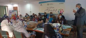 Lady Health Workers in conference room in Pakistan training to distribute UNIMMAP MMS In local provinces