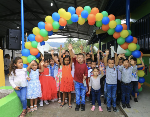 School children standing in front of Angel Zuniga Huete Center of La Entrada Copan, , the 149th kindergarten that the Ficohsa Foundation has supported since 1998