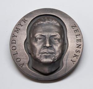 Portrait of Zelensky on medals issued to raise funds for Ukrainian charities.