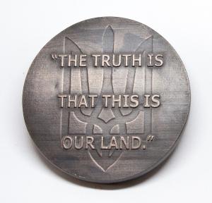 Reverse of Zelensky medal features quote: "The truth is that this is our land."