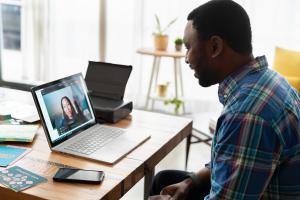 A picture of a medical school graduate working with a mentor to help them with USMLE interviews; this is what Residents Medical can also help with.]