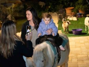 His first pony ride at the children’s Holiday Festival at the Church of Scientology.
