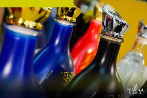Colored bottles of a premium tequila private brand exported by Tequila and Spirits Mexico