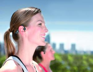 Soli adjustable custom comfort fit open ear wireless Bluetooth headphones on girl exercising outdoors