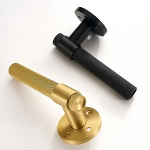 Knurled door handles one black and one gold colour
