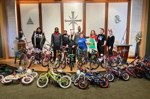 Love and Help Children event team with the bikes they are about to present to underserved children