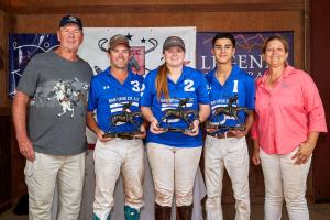 The Blazing Saddles arena polo team hold their trophies after winning the National Arena Amateur Cup