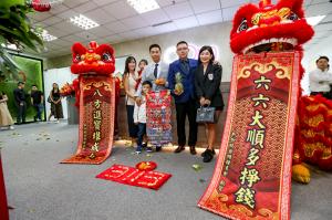 Lion dance performance inside OOm’s new office  symbolises prosperity, success, and good luck