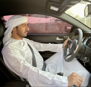 Hamd Al-Nuaimi during a photoshoot with a Ford Mustang Cobra.
