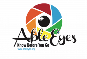 A multicolor circle logo that looks like a camera lense with a pupil in the middle. text says "Know Before you Go"