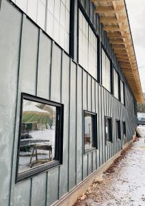 Black exterior of Aspen Distillers building