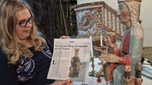Dr. Ana Mafé García shows the wooden sculpture of the Virgin. Image found on the Wall of the Holy Grail.