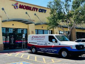 Picture of the Mobility City Phoenix storefront with a technician's van; located at 885 E Warner Rd Ste. 103, Gilbert, AZ 85296