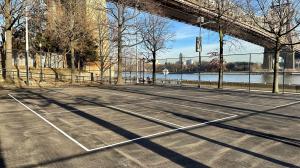 Tennis courts inside a fence at Roosevelt Island