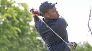 Shamar Wilson, international student from Jamaica tee'ing off on the golf course