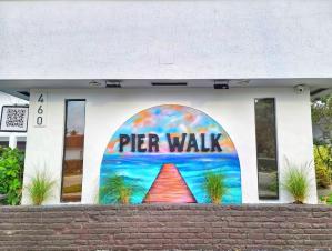 Pier Walk Sign with Mural by MSG Concepts (QR sign located to the left of mural)