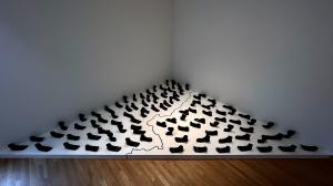 Installation view of Silent Waters by Artist Pritika Chowdhry. One hundred and one ceramics feet, wax, water, salt. 360 in. x 360 in. Ebb/Flow, 2022, Weisman Museum of Art, Minneapolis, MN.