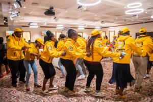 Community members dancing in celebration of their Tools For life graduation.