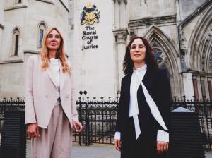 Rachel Cherwitz and Nicole Daedone in front the British Court