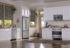White kitchen equipped with stainless steel Viking Range appliances.