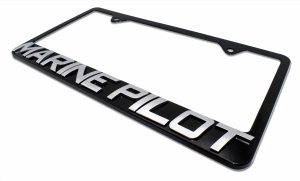 Black license plate frame with the words "Marine Pilot" in chrome lettering