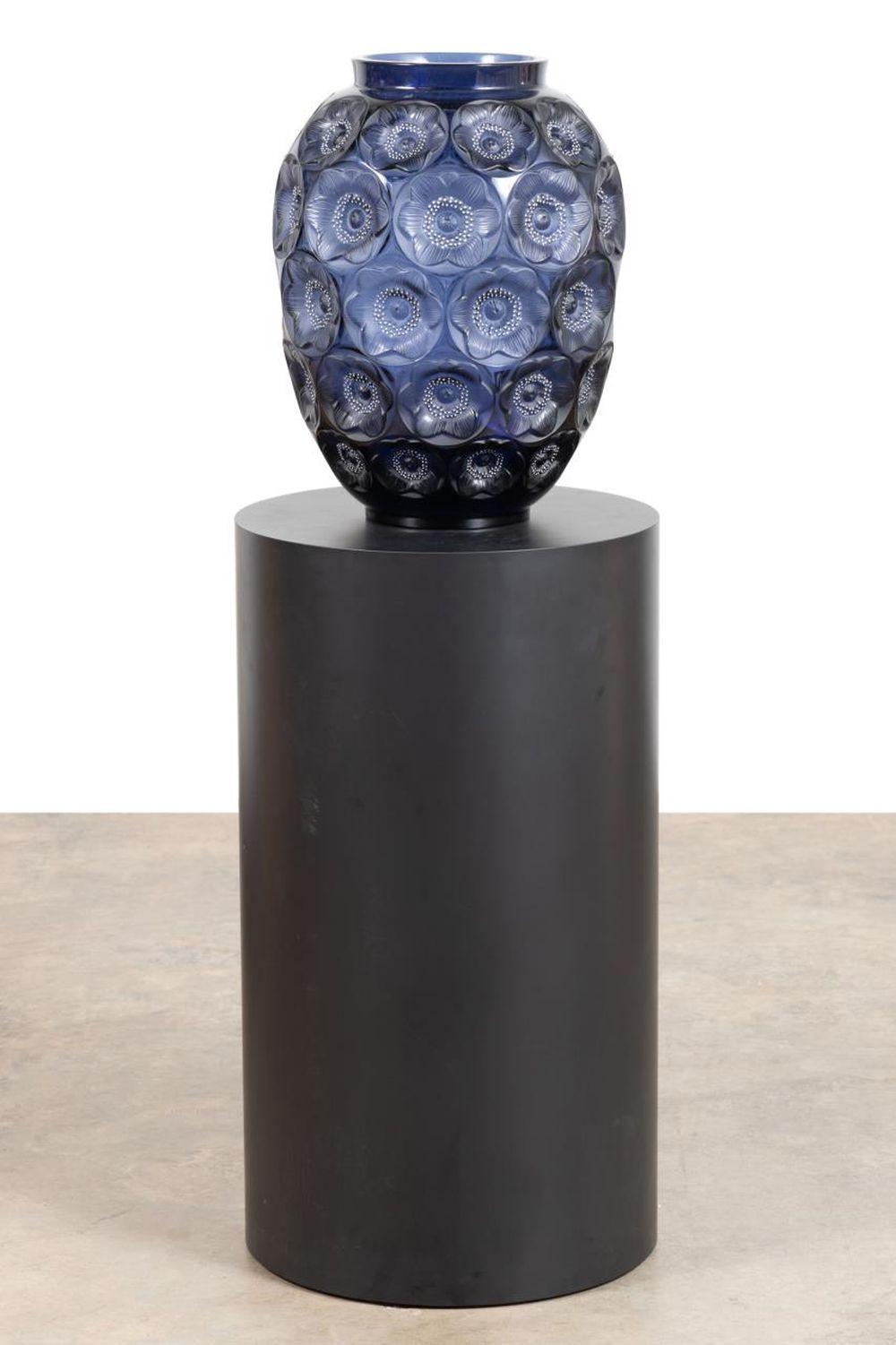 Limited edition Lalique ‘Anemones Grand’ ovoid form vase and pedestal, the vase 19 inches tall and executed in midnight blue crystal with white enamel accents ($24,200).