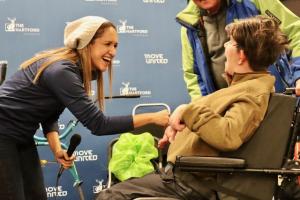 Individuals smiling and connecting with each other
