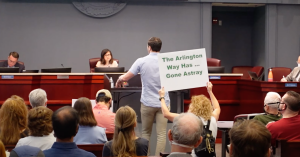 Resident who just had a child questions County board about overcrowded schools and overdevelopment