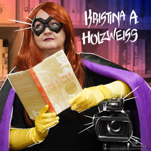 Woman dressed as a superhero holding a book and resting on a video camera in a library