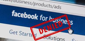 A "Denied" ruling is stamped on an image of a Facebook ad solicitation page