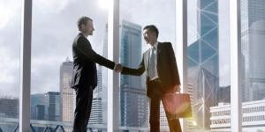 Hong Kong businessman shaking hands with another businessman