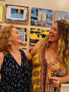 Shira (pictured right) and Susan (Pictured left) laughing while posed side by side.