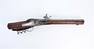 Mid-17th century German Wheelock sporting carbine, 24 inches long (the barrel 16 ½ inches), with a .65 caliber rifled bore and a walnut stock (est. $2,000-$4,000).