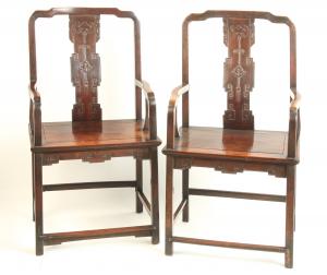 Pair of 18th century hardwood (possibly zitan) “official’s hat” yoke back armchairs with ogee splat carved in low relief and with bat, tassel and other geometric patterns (est. $5,000-$10,000).