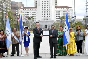 President of COFECA presents a certificate of appreciation to honor Mr. Hubbard for his legacy of help.