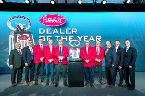 TLG Peterbilt representatives accept Peterbilt North American Dealer of the Year award.