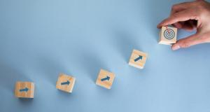 wooden blocks with arrows pointing to target