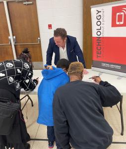 Tommy Swanhaus with TruService is assisting with the Reality Fair for the students.