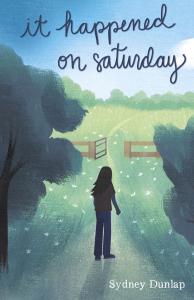 Cover of the the middle grade novel "It Happened on Saturday." The image features the back of girl standing in grass, looking at an open gate to a horse pasture. On the sides you see beautiful dark green trees. The sky is blue, and that is where the book